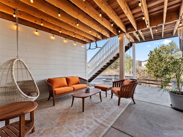 view of patio featuring a fire pit and stairs