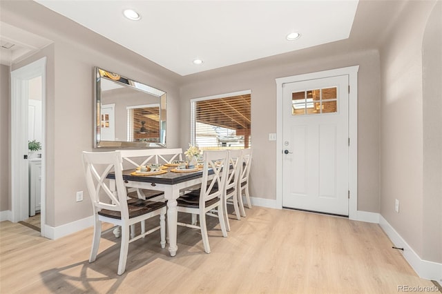 dining room featuring recessed lighting, baseboards, and light wood finished floors