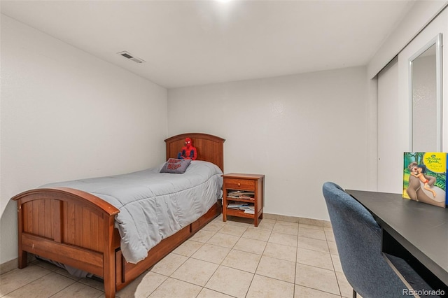 bedroom with visible vents and light tile patterned flooring