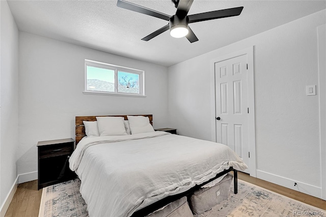2544 S Raleigh St, Denver, CO 80219 - bedroom featuring light wood-style flooring, baseboards, and a ceiling fan