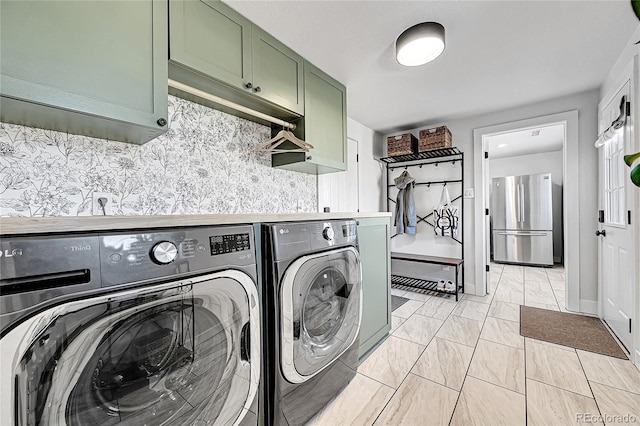 2544 S Raleigh St, Denver, CO 80219 - laundry area featuring cabinet space and washer and dryer
