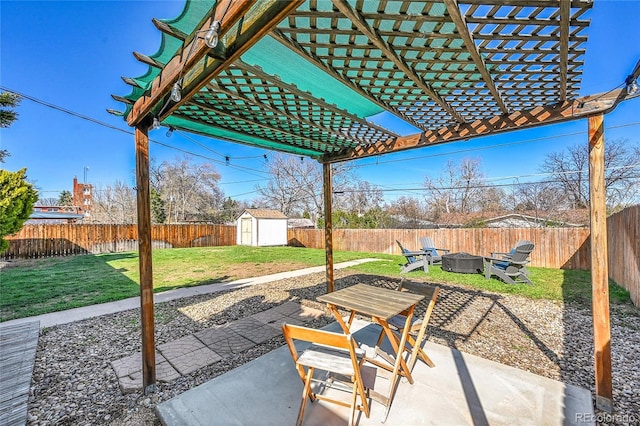 2544 S Raleigh St, Denver, CO 80219 - view of patio / terrace featuring a shed, a fire pit, a fenced backyard, and an outdoor structure
