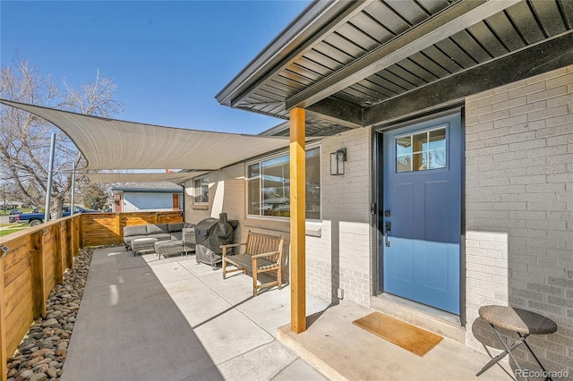 2544 S Raleigh St, Denver, CO 80219 - view of patio featuring an outdoor living space, grilling area, and fence