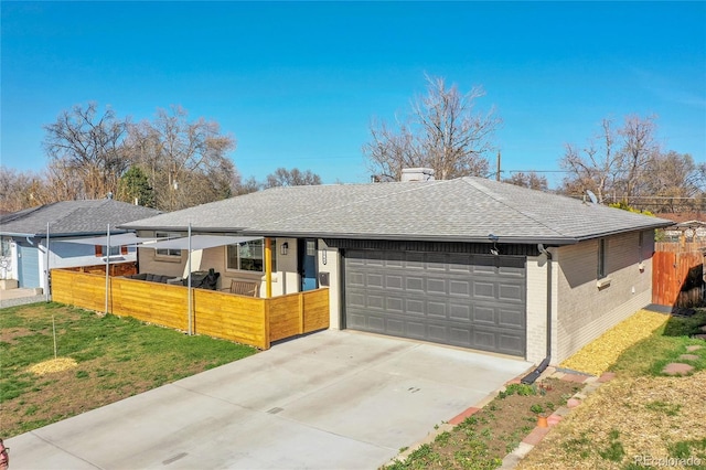 2544 S Raleigh St, Denver, CO 80219 - ranch-style home featuring driveway, an attached garage, brick siding, fence, and a shingled roof