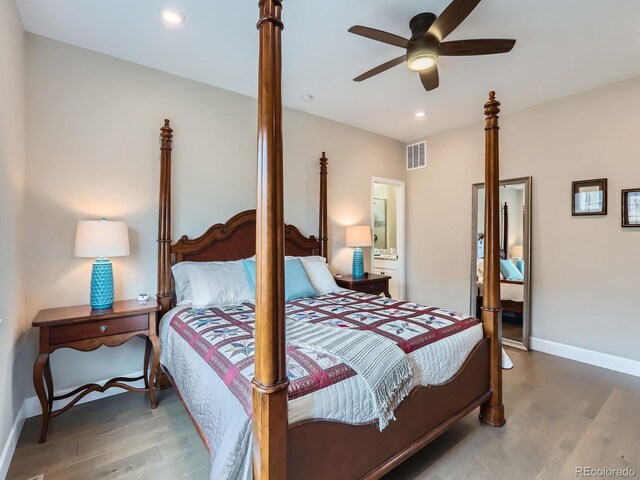 bedroom featuring recessed lighting, visible vents, baseboards, and wood finished floors