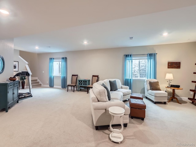 living area featuring stairway, recessed lighting, light colored carpet, and baseboards