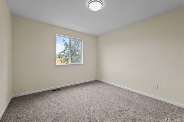 spare room featuring carpet floors