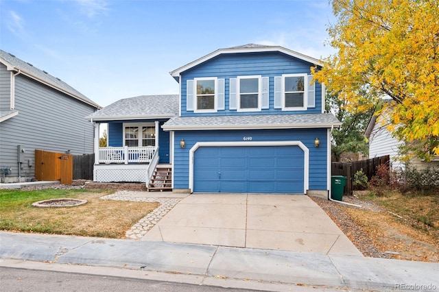 view of front of property featuring a garage and a porch