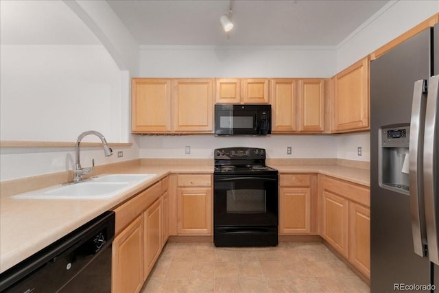 5255 Memphis St Unit 219, Denver, CO 80239 - kitchen with black appliances, light brown cabinetry, and light countertops