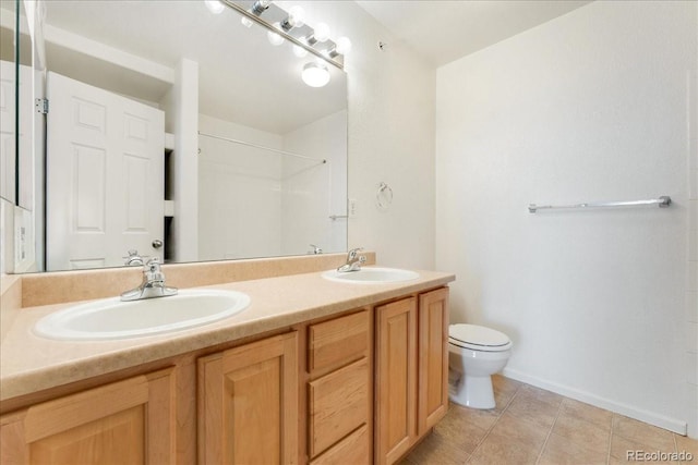 5255 Memphis St Unit 219, Denver, CO 80239 - bathroom with double vanity, tile patterned flooring, and a shower
