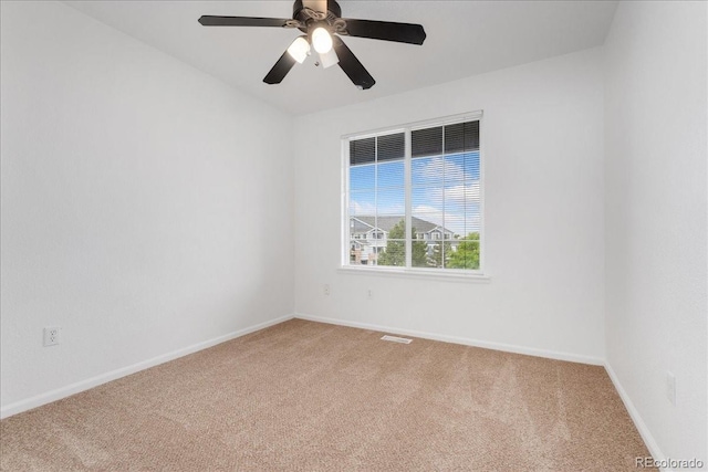 5255 Memphis St Unit 219, Denver, CO 80239 - empty room featuring light colored carpet and a ceiling fan