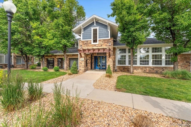 5255 Memphis St Unit 219, Denver, CO 80239 - craftsman inspired home with stone siding, a front yard, and a shingled roof