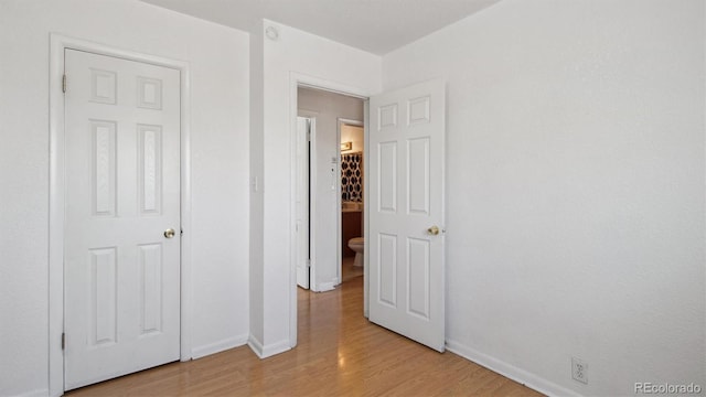 766 Fulton Ave, Brighton, CO 80601 - unfurnished bedroom with baseboards and light wood-type flooring