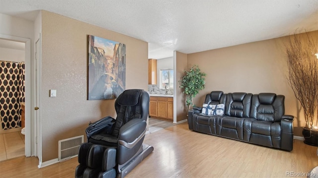 766 Fulton Ave, Brighton, CO 80601 - living area featuring light wood-style floors and baseboards