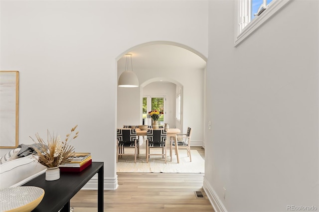 corridor featuring hardwood / wood-style floors