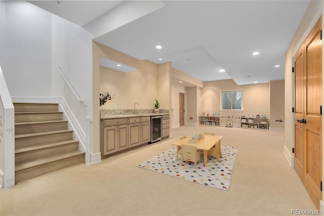 carpeted living room featuring indoor bar and beverage cooler