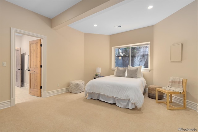 carpeted bedroom featuring beamed ceiling