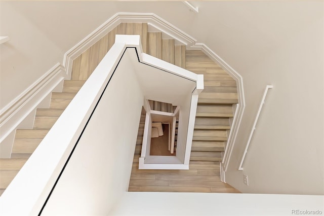 stairway with wood finished floors