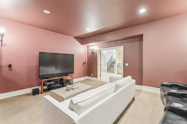 living room with recessed lighting, light colored carpet, stairs, and baseboards