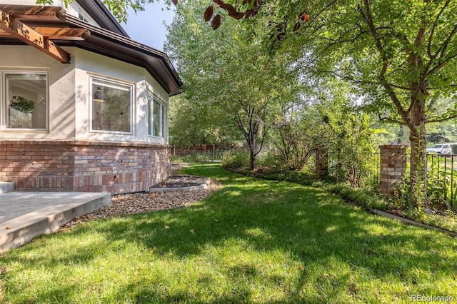 view of yard with fence