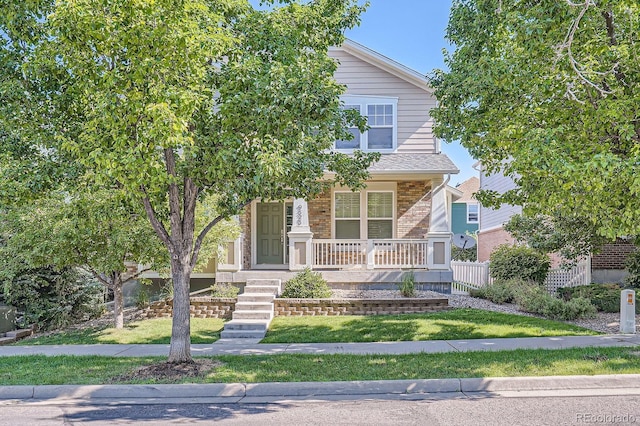 9523 Gray Ct, Westminster, CO 80031 - view of property hidden behind natural elements with covered porch and brick siding