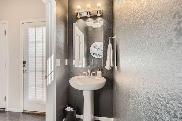 9523 Gray Ct, Westminster, CO 80031 - bathroom with baseboards and a sink