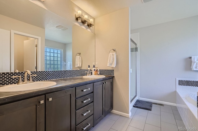 9523 Gray Ct, Westminster, CO 80031 - full bathroom with double vanity, a garden tub, a shower stall, tile patterned floors, and radiator heating unit