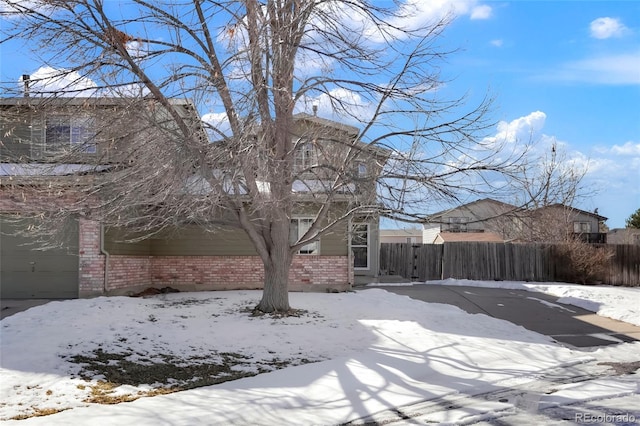 yard covered in snow with a garage