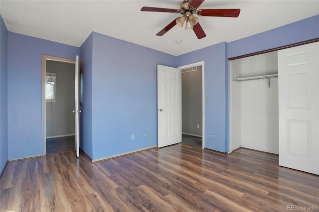 unfurnished bedroom featuring dark hardwood / wood-style flooring, a closet, and ceiling fan