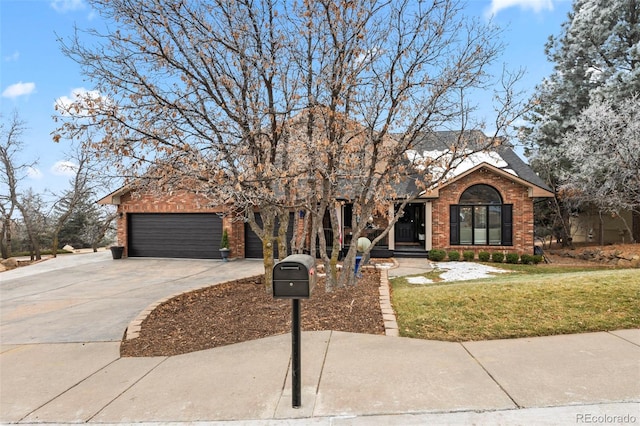 view of front facade with a front lawn and a garage