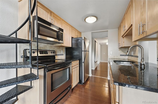9797 E Peakview Ave Unit C10, Englewood, CO 80111 - kitchen with appliances with stainless steel finishes, a sink, light brown cabinets, dark wood finished floors, and decorative backsplash