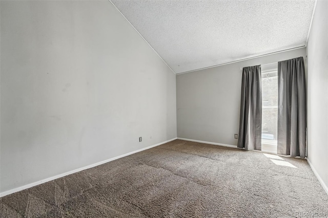 9797 E Peakview Ave Unit C10, Englewood, CO 80111 - empty room featuring a textured ceiling, vaulted ceiling, carpet, and baseboards