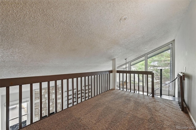 9797 E Peakview Ave Unit C10, Englewood, CO 80111 - hallway with carpet flooring, a textured ceiling, and a wall of windows
