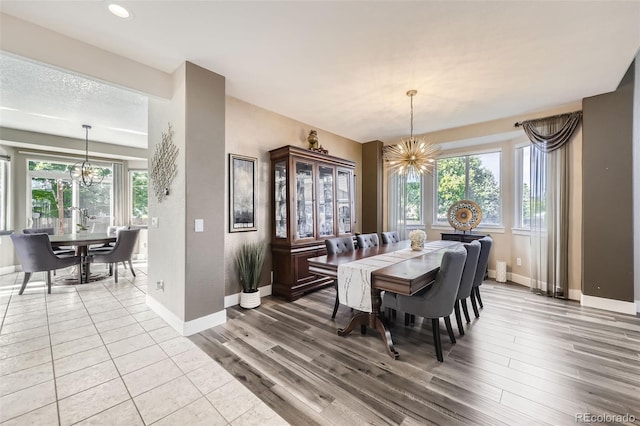 12693 W 82nd Ln, Arvada, CO 80005 - dining room with a chandelier, baseboards, plenty of natural light, and recessed lighting