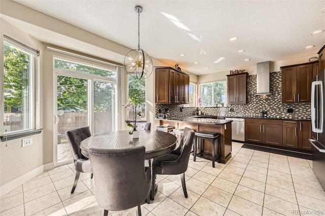 12693 W 82nd Ln, Arvada, CO 80005 - dining area featuring healthy amount of natural light, light tile patterned floors, baseboards, and recessed lighting