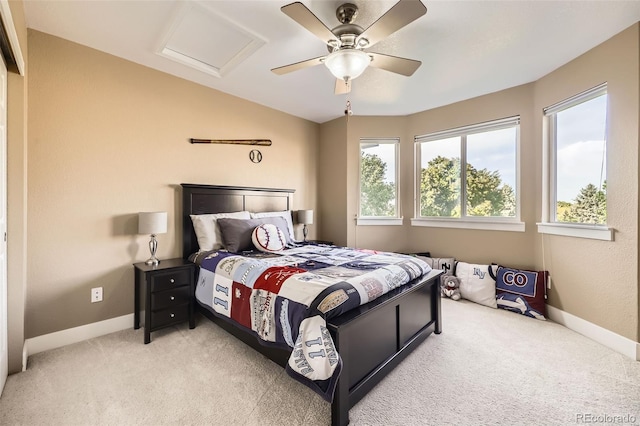 12693 W 82nd Ln, Arvada, CO 80005 - bedroom featuring multiple windows, light carpet, and baseboards