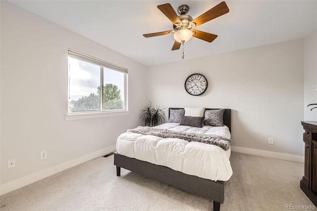 12693 W 82nd Ln, Arvada, CO 80005 - bedroom with light carpet, baseboards, and ceiling fan