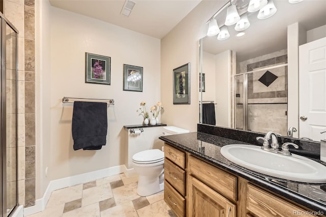 12693 W 82nd Ln, Arvada, CO 80005 - full bath with vanity, baseboards, toilet, and a shower stall