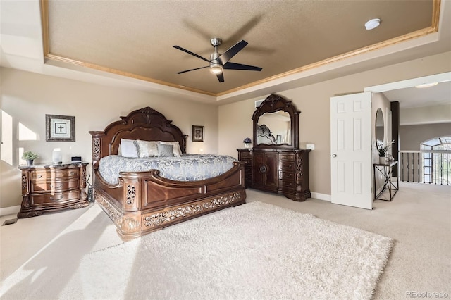 12693 W 82nd Ln, Arvada, CO 80005 - carpeted bedroom with a tray ceiling, baseboards, and a ceiling fan