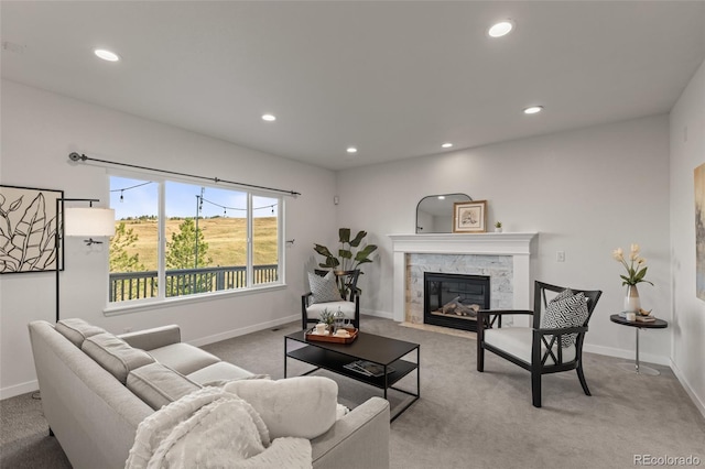 3182 Cimarron Pl, Superior, CO 80027 - carpeted living room with baseboards, a stone fireplace, and recessed lighting