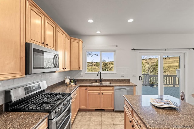 3182 Cimarron Pl, Superior, CO 80027 - kitchen featuring tasteful backsplash, a sink, appliances with stainless steel finishes, recessed lighting, and dark stone counters