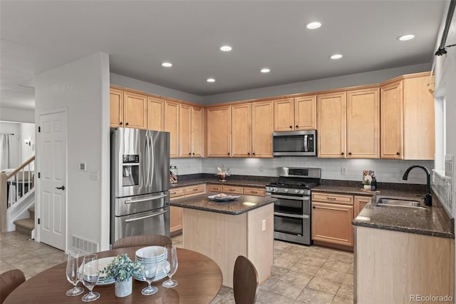 3182 Cimarron Pl, Superior, CO 80027 - kitchen featuring a sink, tasteful backsplash, appliances with stainless steel finishes, and recessed lighting