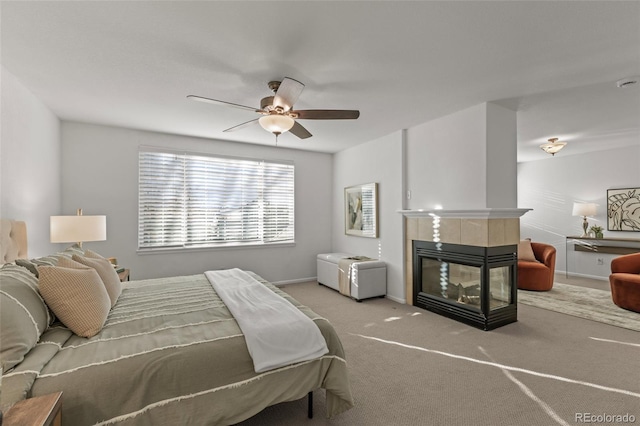 3182 Cimarron Pl, Superior, CO 80027 - bedroom with carpet floors, baseboards, a ceiling fan, and a fireplace