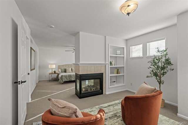 3182 Cimarron Pl, Superior, CO 80027 - living area with a fireplace, carpet, baseboards, and a ceiling fan