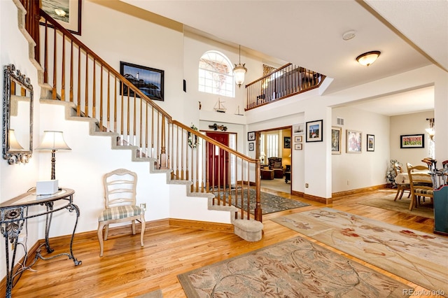 1820 Sapling Ct, Castle Rock, CO 80109 - foyer entrance featuring wood finished floors, stairs, and baseboards