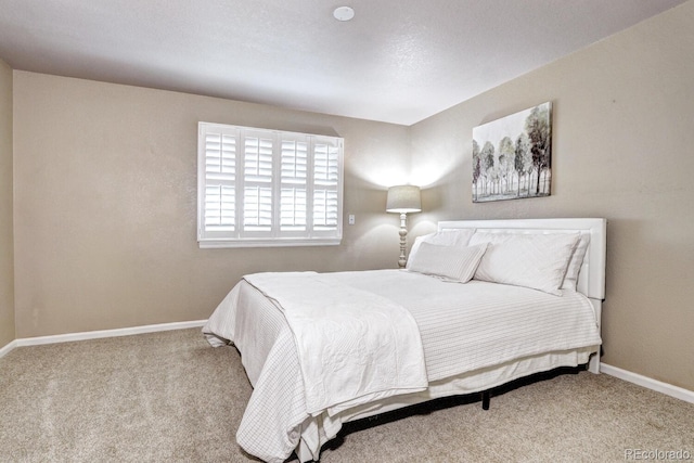 bedroom featuring carpet