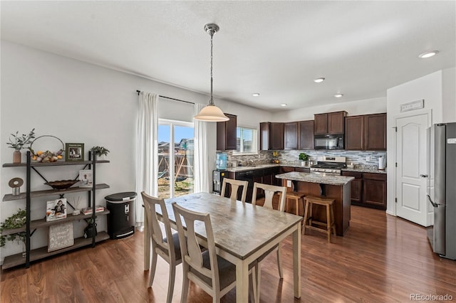 dining area with recessed lighting and dark wood-style floors