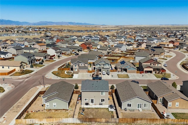 drone / aerial view with a mountain view and a residential view