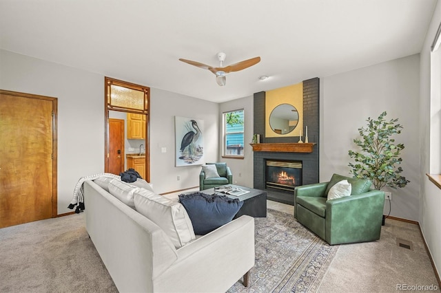 1190 W 11th Ct, Broomfield, CO 80020 - living room with a fireplace, carpet floors, ceiling fan, and baseboards