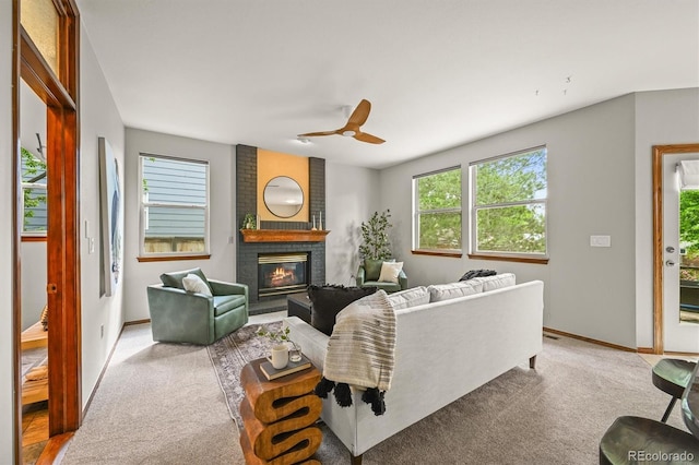 1190 W 11th Ct, Broomfield, CO 80020 - living area with healthy amount of natural light, a brick fireplace, baseboards, and carpet flooring